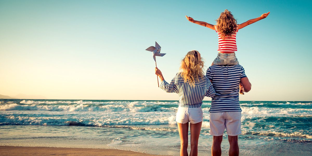 Happy family on the beach. People having fun on summer vacation. Father ...